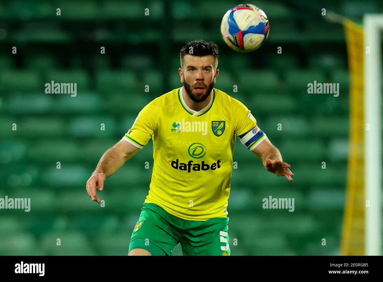 2nd January 2021; Carrow Road, Norwich, Norfolk, England, English Football League Championship Football, Norwich versus Barnsley; Grant Hanley of Norwich City prepares to head the ball carefully after suffering a head injury Stock Photo
