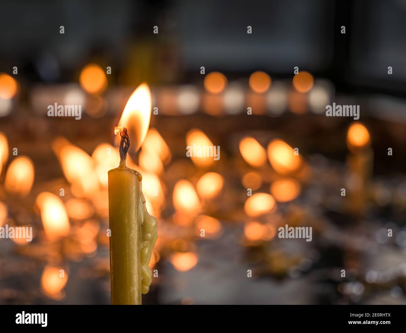 Burning candles in memory of the dead. Melted wax from candles Stock