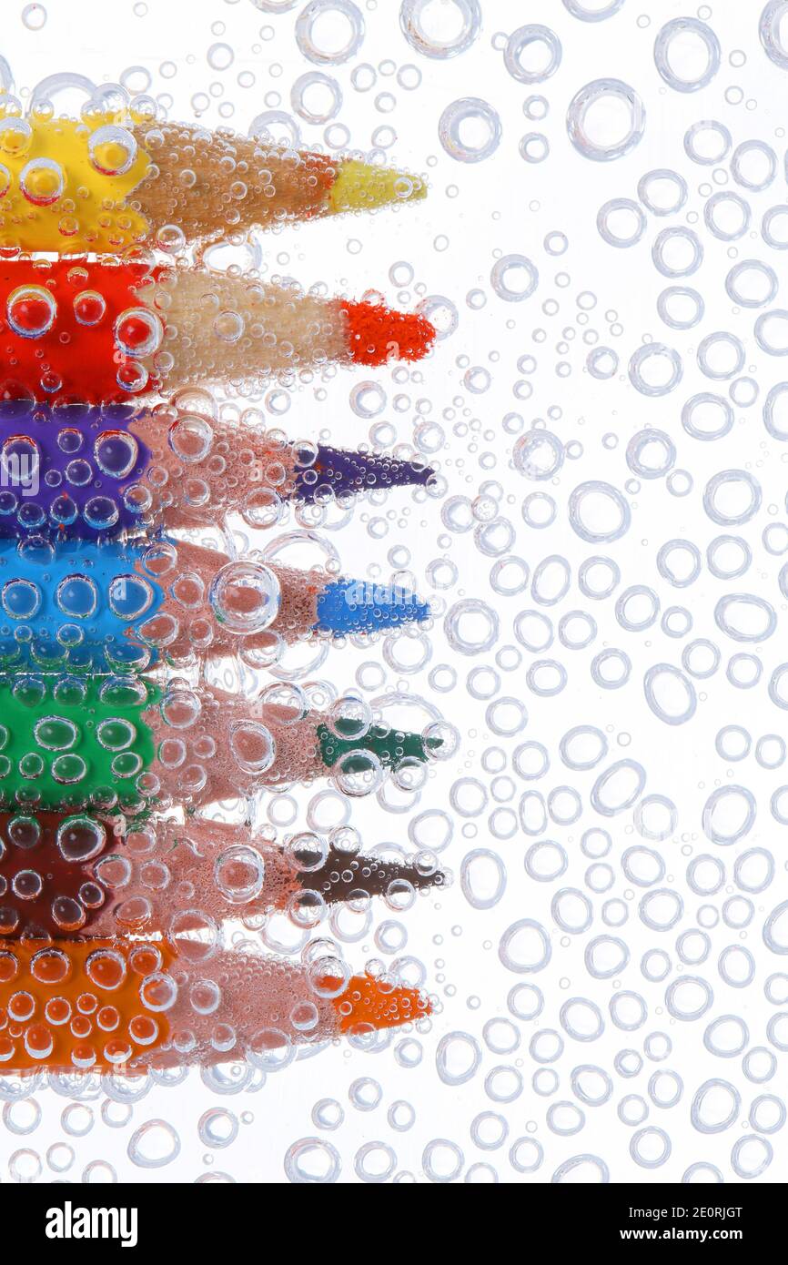 Colored pencils in air bubbles Stock Photo