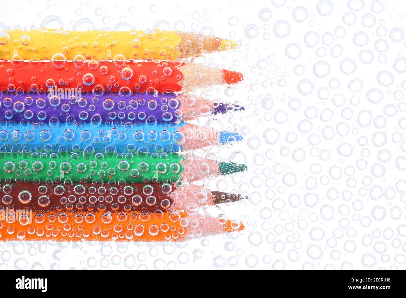 Colored pencils in air bubbles Stock Photo