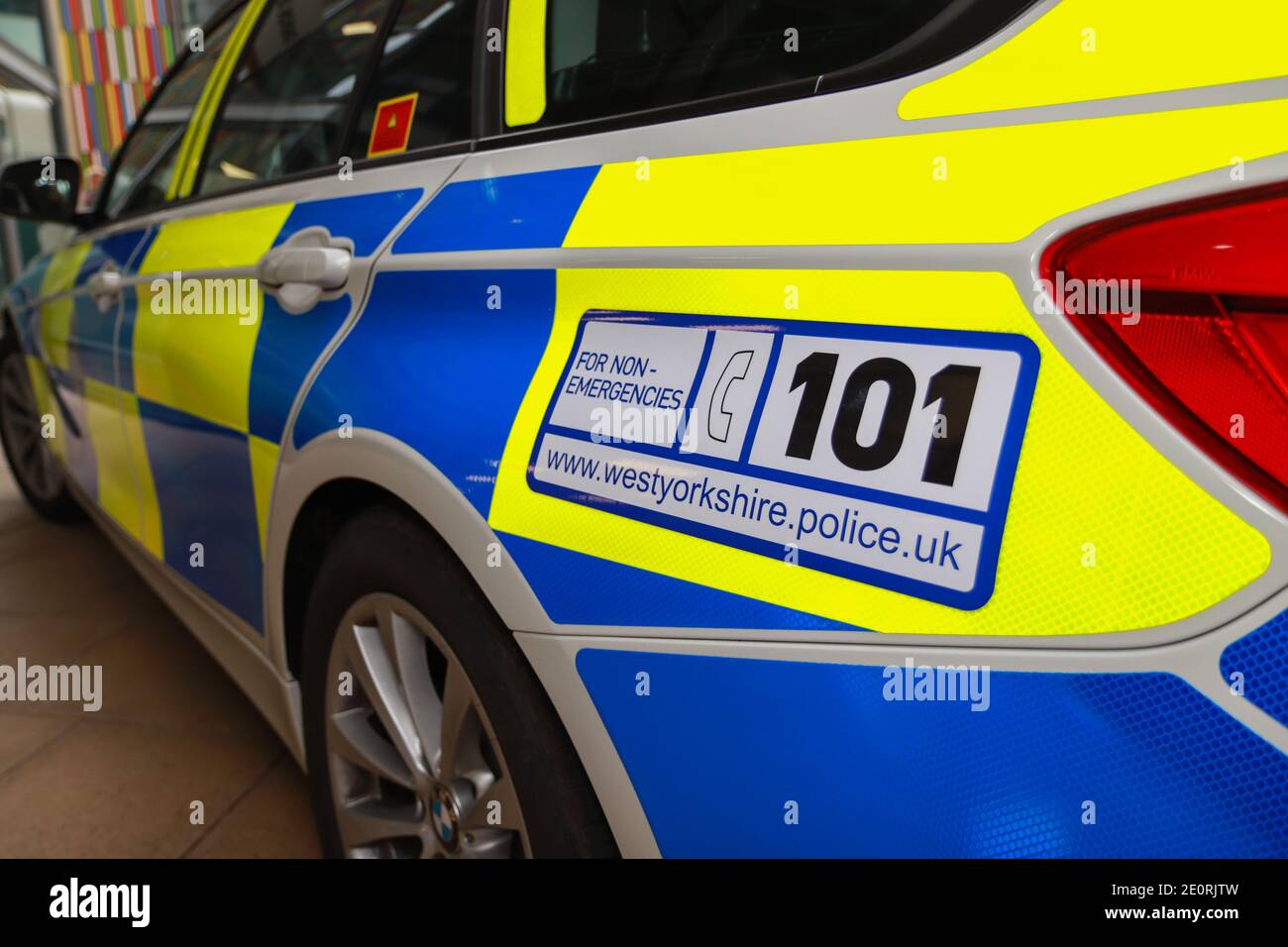A close up photo of a British police car from the West Yorkshire police sowing the side of the car Stock Photo