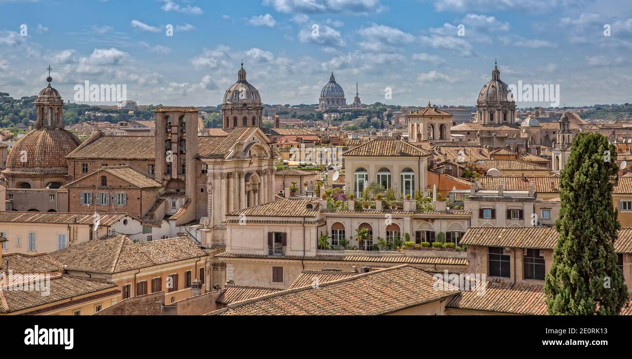 Rooftop view of the city skyline of Rome. City skyline with Saint Peter Basilica in the background in a summer day, Rome, Italy Stock Photo