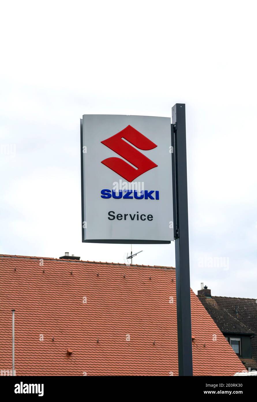 Cadolzburg, GERMANY : SUZUKI logo, dealer in Furth, Germany. Suzuki Motor Corporation is a Japanese multinational corporation Stock Photo