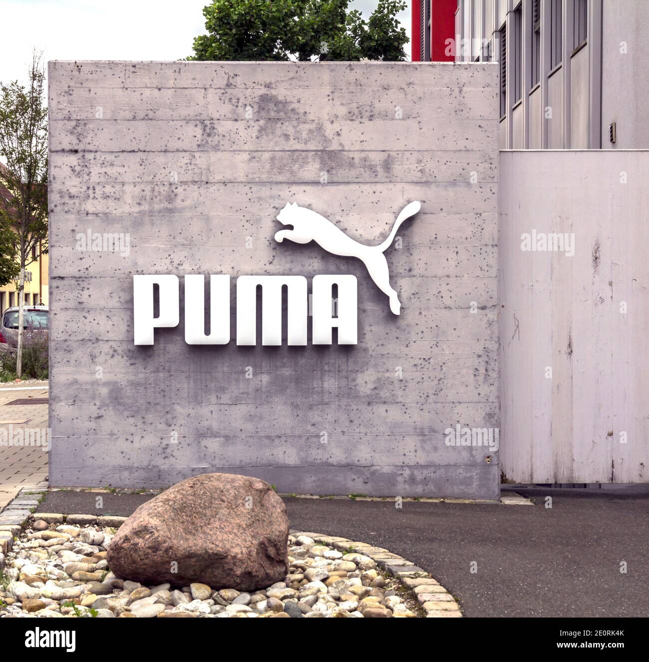 Puma logo on a facade. Puma is a major german multinational company that  produces athletic, casual footwear, sportswear, headquartered in Bavaria  Stock Photo - Alamy