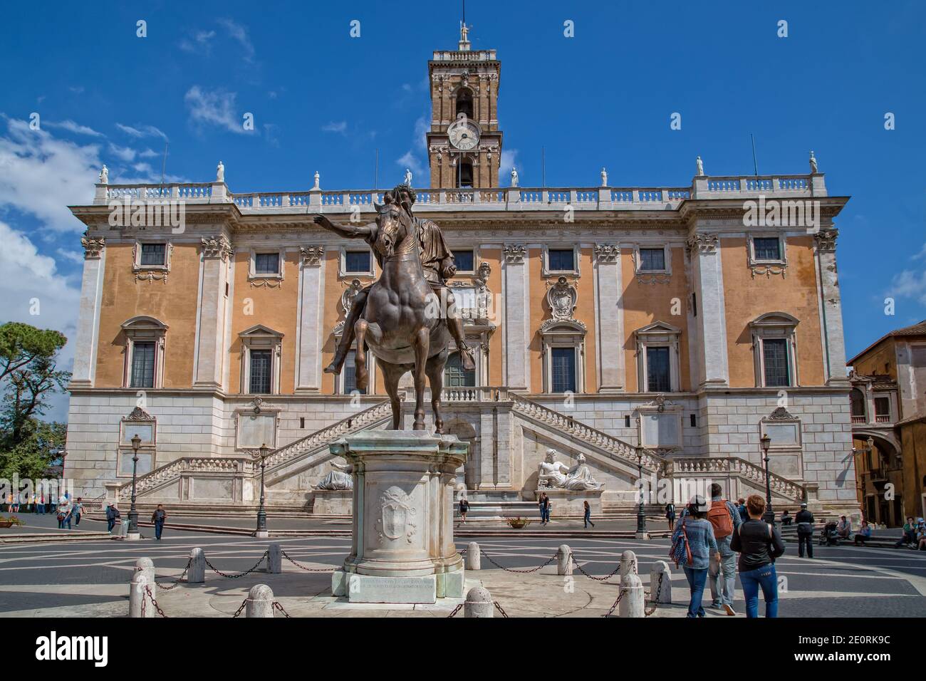 Bronze statue of the Roman emperor Marcus Aurelius.Tourist visits the Senatorial Palace on Capitoline Hill (Piazza del Campidoglio) in Rome, Italy Stock Photo