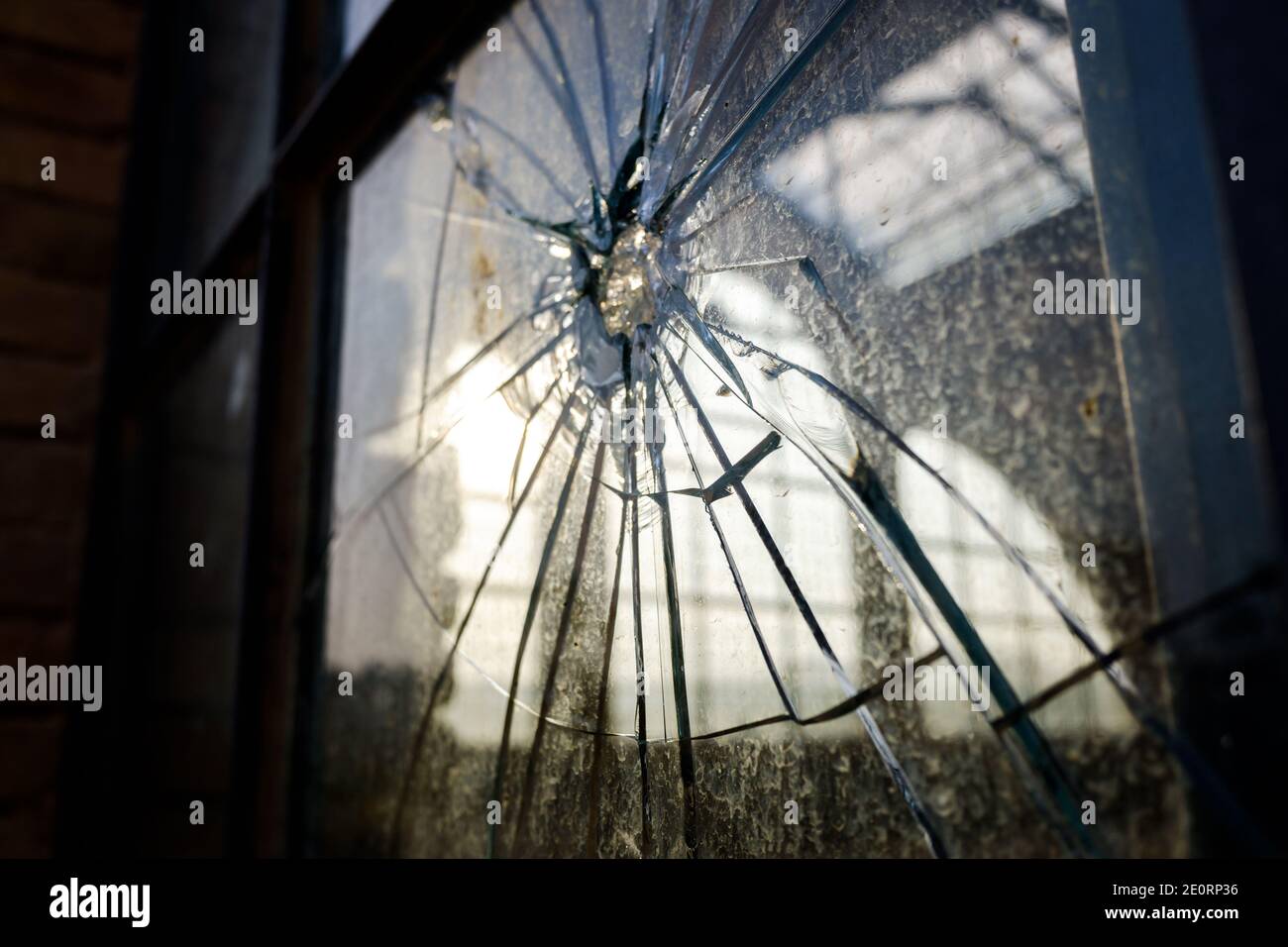 Stoned window with broken glass of an industry Stock Photo - Alamy