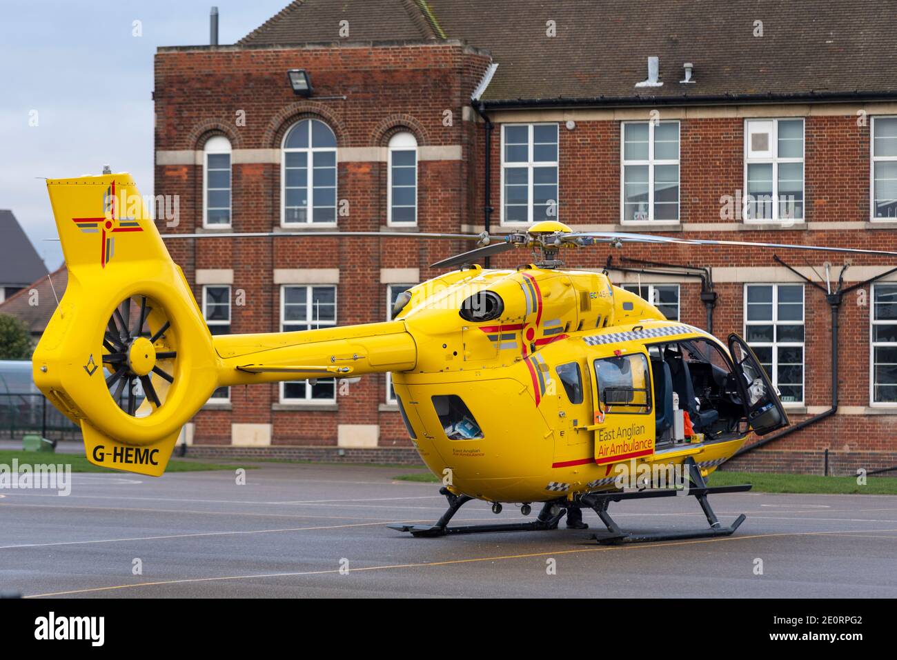East Anglian Air Ambulance Airbus Helicopters H145 helicopter registered G-HEMC landed in the grounds of the Southend High School for Boys school Stock Photo