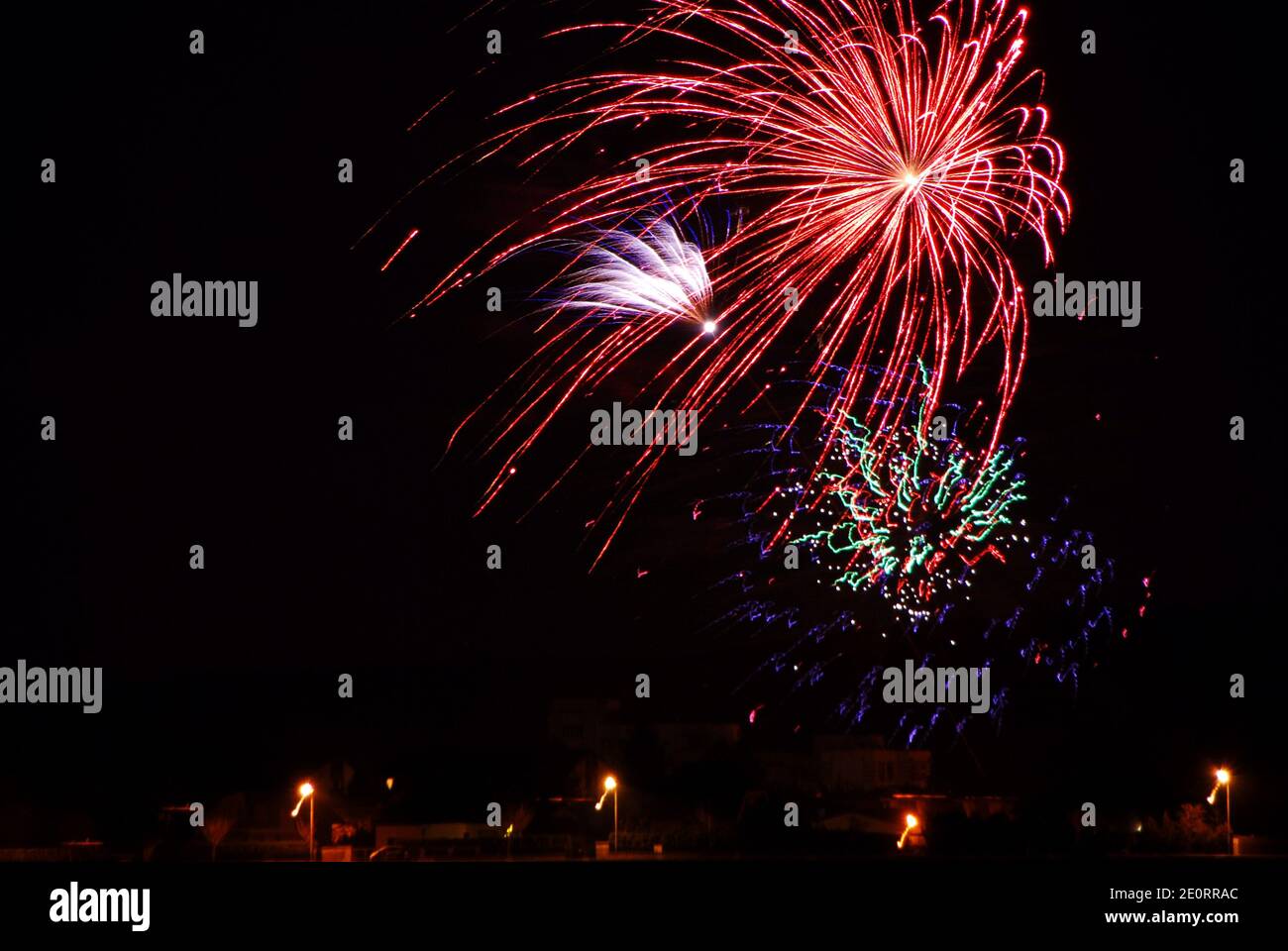 colorful big red fireworks in the night to silvester Stock Photo - Alamy