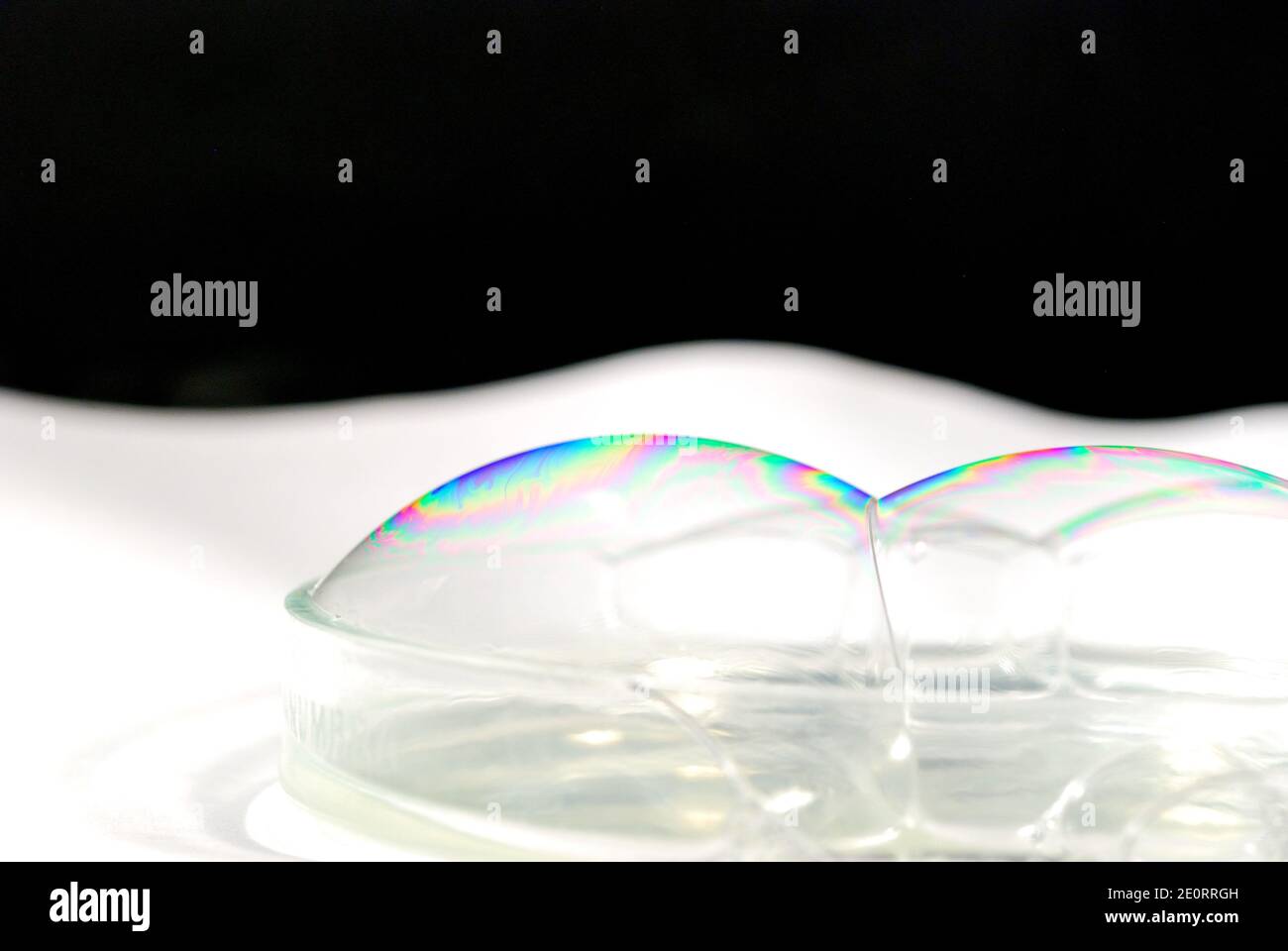 many white reflective background with black soap bubbles Stock Photo ...