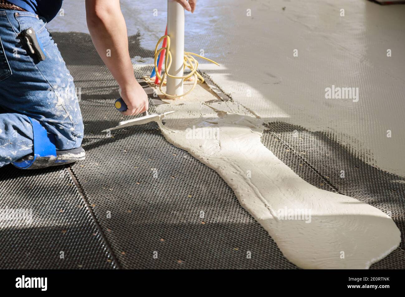 Preparation before pouring concrete in troweling adhesive onto floor a