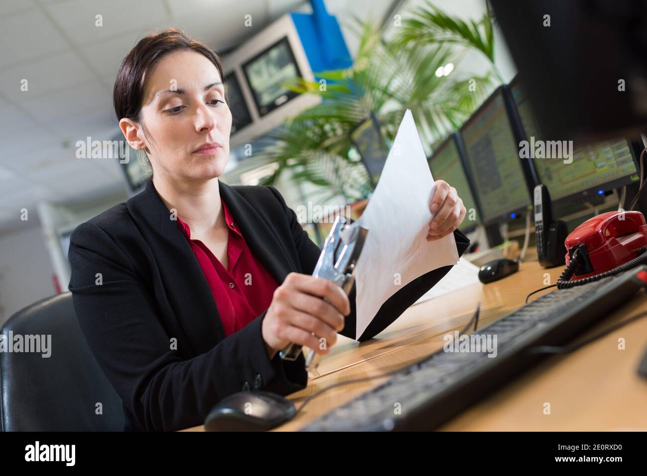 woman stapling papers with stapler Stock Photo - Alamy