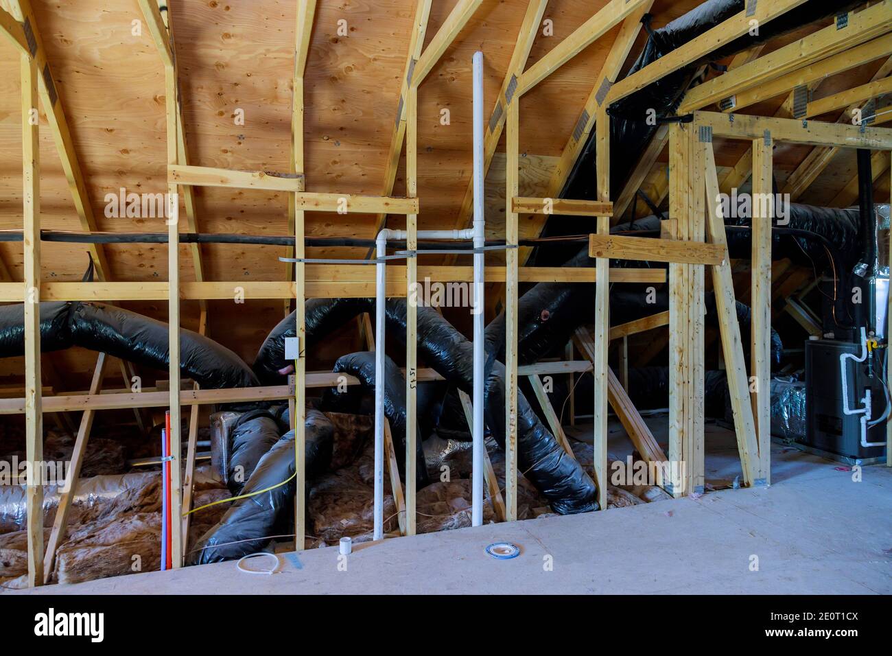 House under construction roof of HVAC vents being installed air