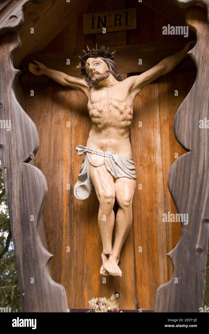 An Austrian-style wooden crucifixion carving in a trailside altar ...