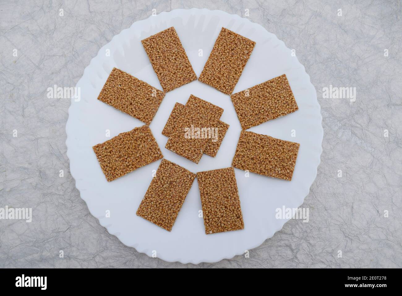 Til sakri or Tilgul an Indian traditional popular sweet made out of Sesame seeds and jaggery melted and set in to sheets and cut. Famous Sankranti fes Stock Photo