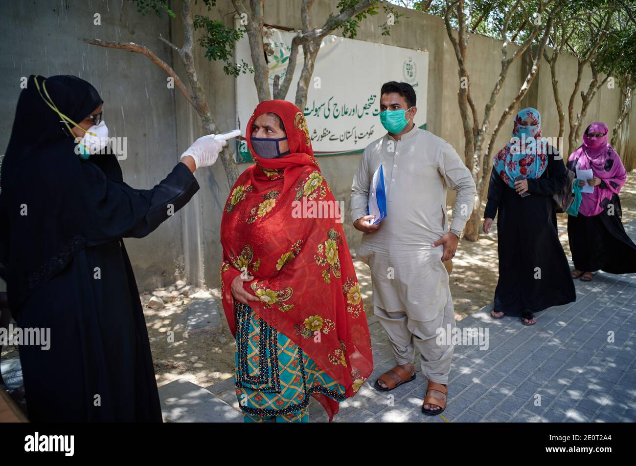TB patients are being screened for coronavirus at the entrance to the Gori TB Clinic at the Indus Hospital in Korangi, Karachi, Pakistan. Stock Photo
