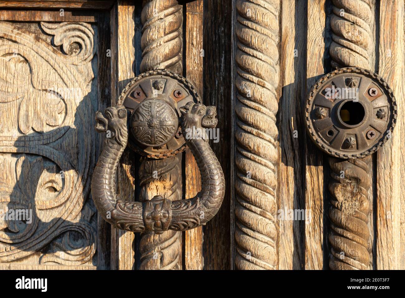 Ornamental door handle on old carved wood panel door knocker detail of the historic St. Alexander Nevsky Orthodox Cathedral church in Sofia Bulgaria Stock Photo
