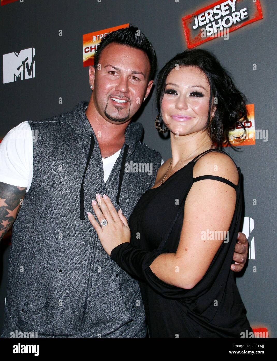 Roger Matthews and Jenni "JWOWW" Farley attend the Jersey Shore final season premiere event at