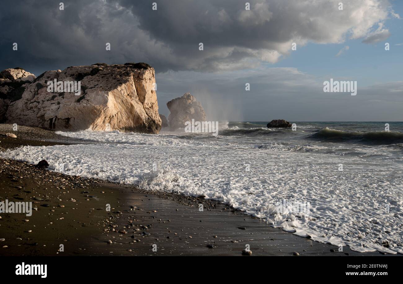 Seascape with windy waves during stormy Rock of Aphrodite Paphos Cyprus. Stock Photo