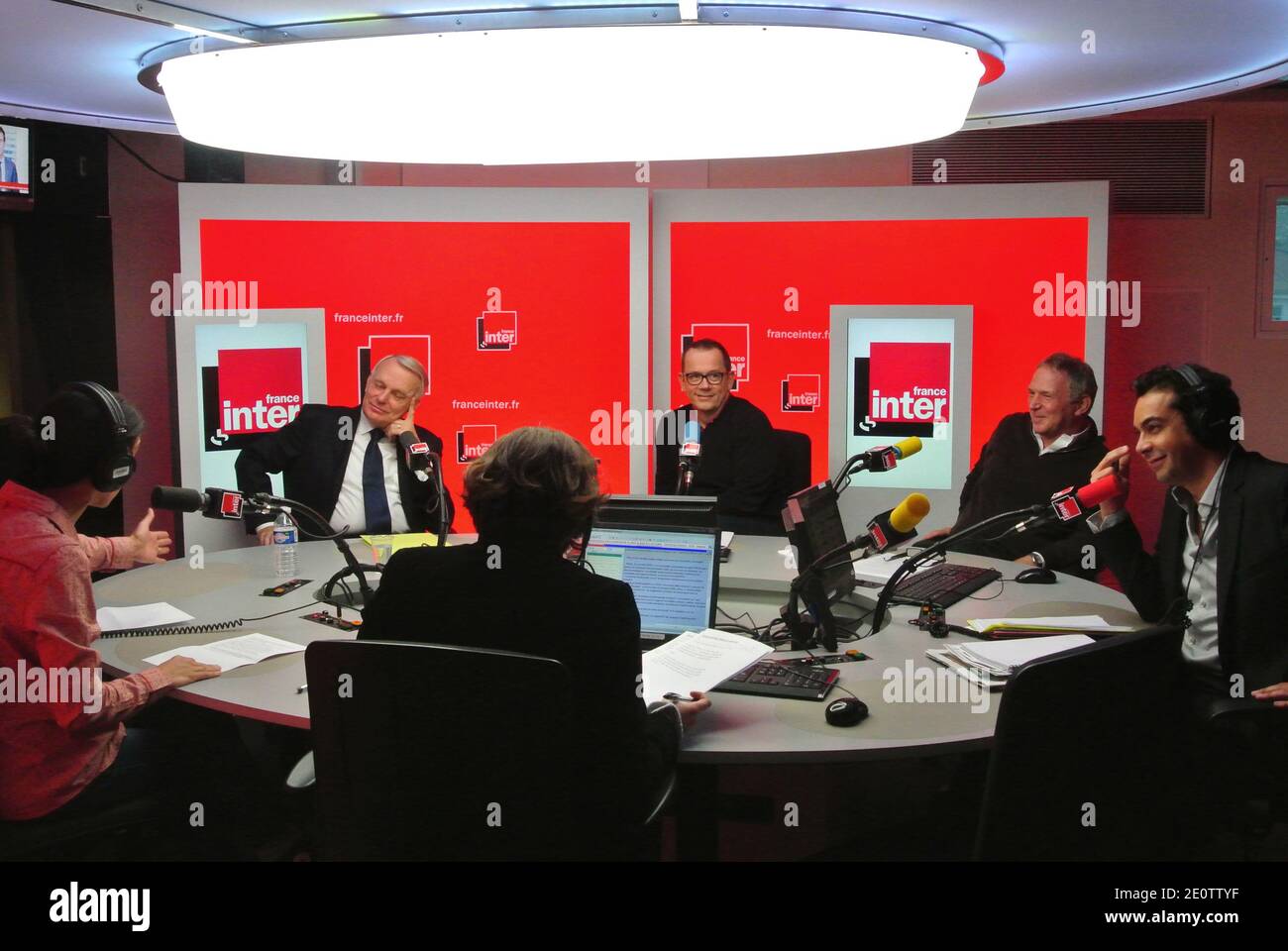 L-R : Sophia Aram, French Prime Minister Jean-Marc Ayrault, Thomas Legrand,  Bernard Guetta and Patrick Cohen (right) at La Matinale program of France  Inter radio station at the Maison de Radio France