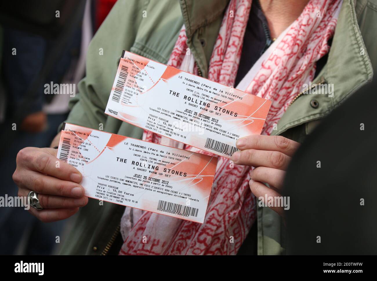 A person shows tickets for a concert held the same day in the French  capital by British rock legends The Rolling Stones at the Virgin megastore  on Champs Elysees in Paris, France