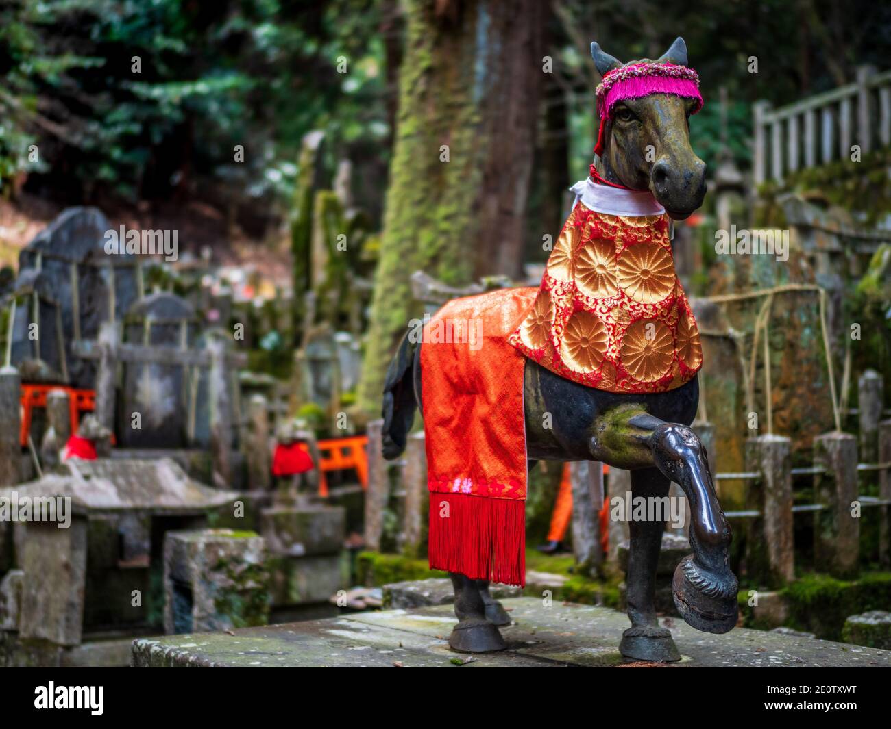 Horse Statue Fushimi Inari Shrine Kyoto Japan. Fushimi Inari Horse statue dressed in red ceremonial robes. Stock Photo