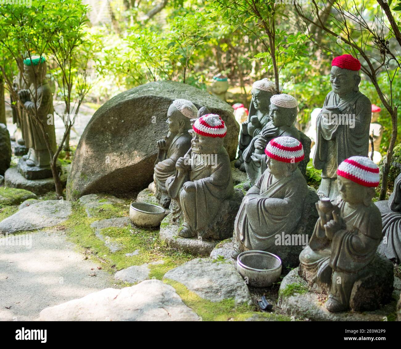 Statues of the original followers of Buddha (called Shaka Nyorai in Japan), with knitted caps at Daisho-in Temple (Daishoin Temple), Miyajima, Japan. Stock Photo