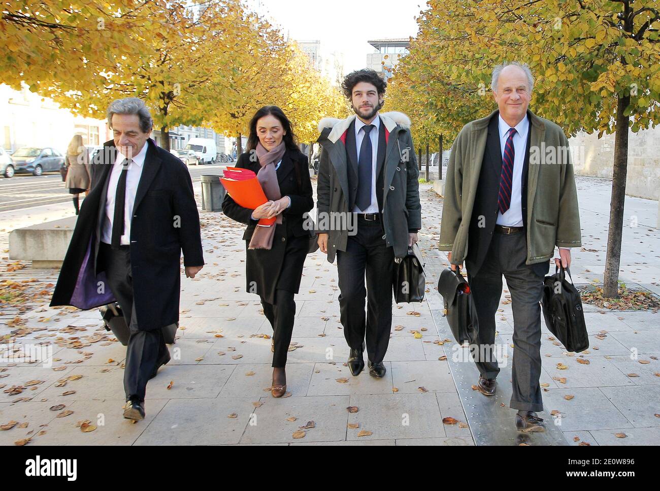 L'Oreal heiress French Lilian Bettencourt's former financial advisor  Patrice de Maistre (R) arrives flanked by his lawyer Christophe Carriou  Martin, Jacqueline Laffont and Pierre Haik prior to a hearing by judge Jean -Michel