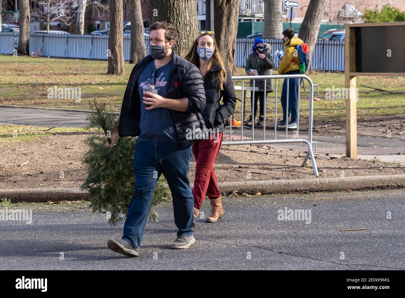 NEW YORK, NY JANUARY 2 A couple brings a christmas tree to be