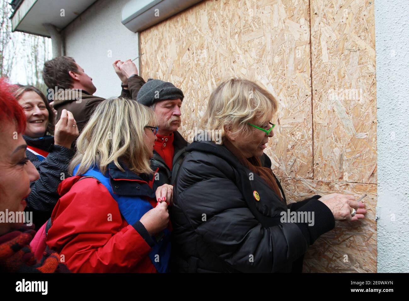 Europe Ecologie European Parliament Deputy Jose Bove and EELV member Eva Joly are about to remove a wooden plaque fence which was blocking a window of a house whose inhabitants have been expropriated for the Notre-Dame-des-Landes airport project, in the Grandchamp des Fontaines district, near Nantes, western France on November 16, 2012. The house owners as many others in the area have been expropriated and their house is to be demolished by Vinci Group in charge of the new airport construction. Photo by Laetitia Notarianni/ABACAPRESS.COM Stock Photo