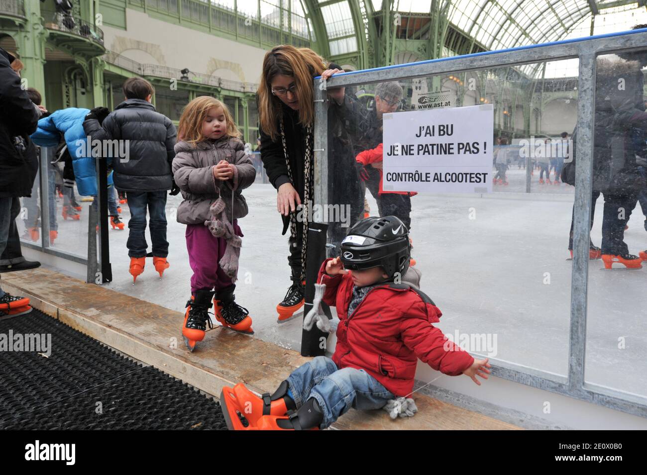 Visitors ice-skate on a giant rink hosted in the glass-roofed central hall of the Grand Palais, in Paris, France, on December 12, 2012. The rink who is the largest rink ever created in France is 1,800 square meters large and can receive 1000 people at the same time. Photo by Christophe Guibbaud/ABACAPRESS.COM. Stock Photo