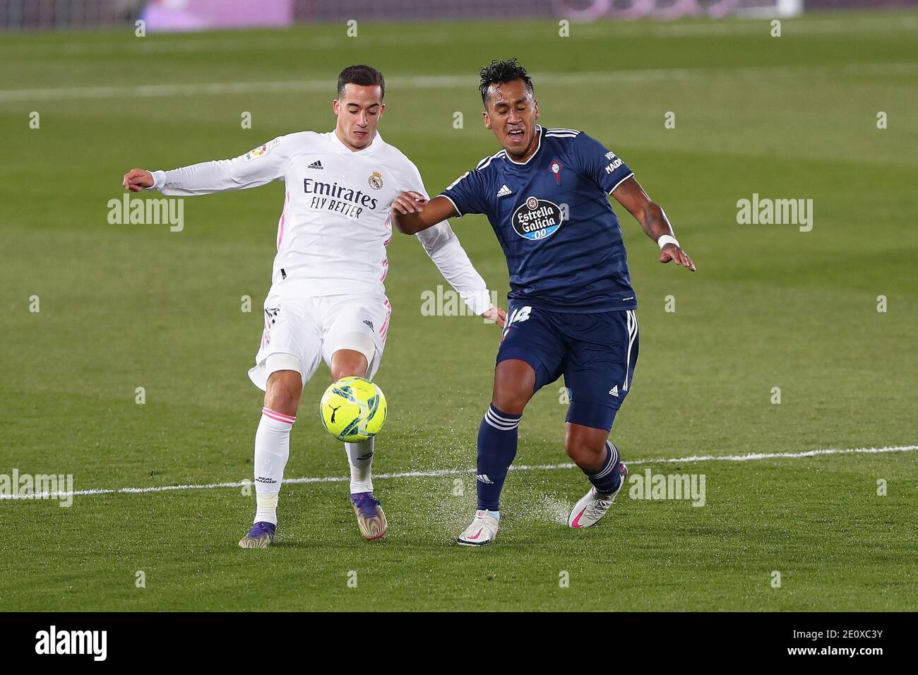 Madrid, Spain. 2nd Jan, 2021. Real Madrid's Lucas Vazquez (L) vies with Celta Vigo's Renato Tapia during a Spanish league football match between Real Madrid and Celta Vigo in Madrid, Spain, on Jan. 2, 2021. Credit: Edward F. Peters/Xinhua/Alamy Live News Stock Photo