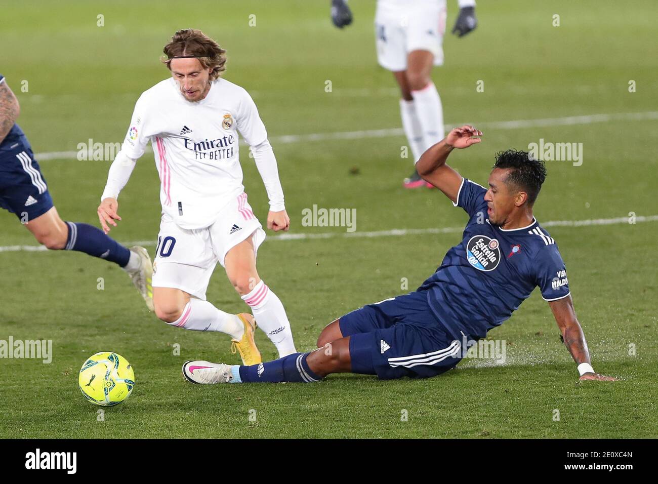 Madrid, Spain. 2nd Jan, 2021. Real Madrid's Luka Modric (L) vies with Celta Vigo's Renato Tapia during a Spanish league football match between Real Madrid and Celta Vigo in Madrid, Spain, on Jan. 2, 2021. Credit: Edward F. Peters/Xinhua/Alamy Live News Stock Photo
