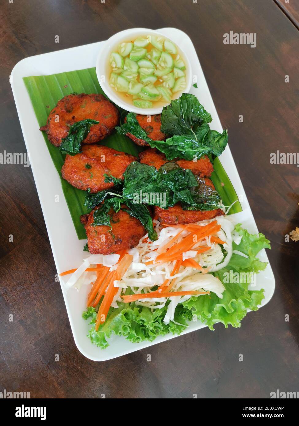 Fish cake, fried spicy fish balls top with crispy basil and sweet sauce