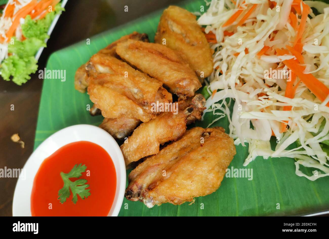 Fried Chicken Wings with Chili Sauce. Thai food Stock Photo - Alamy