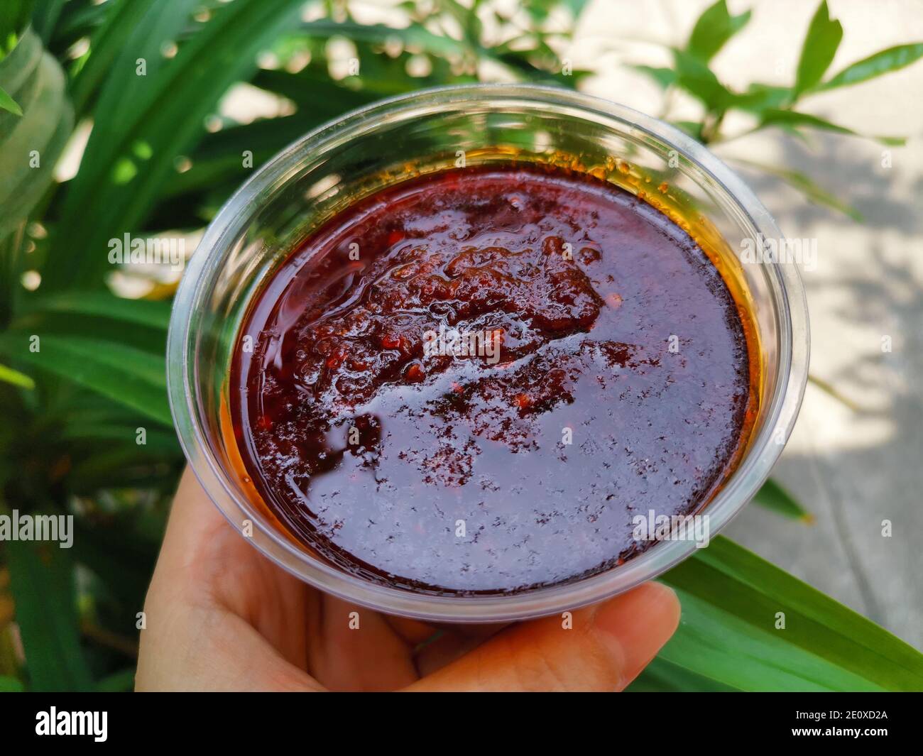 Chili paste in a plastic cup. Thai dips are sweet and spicy Stock Photo