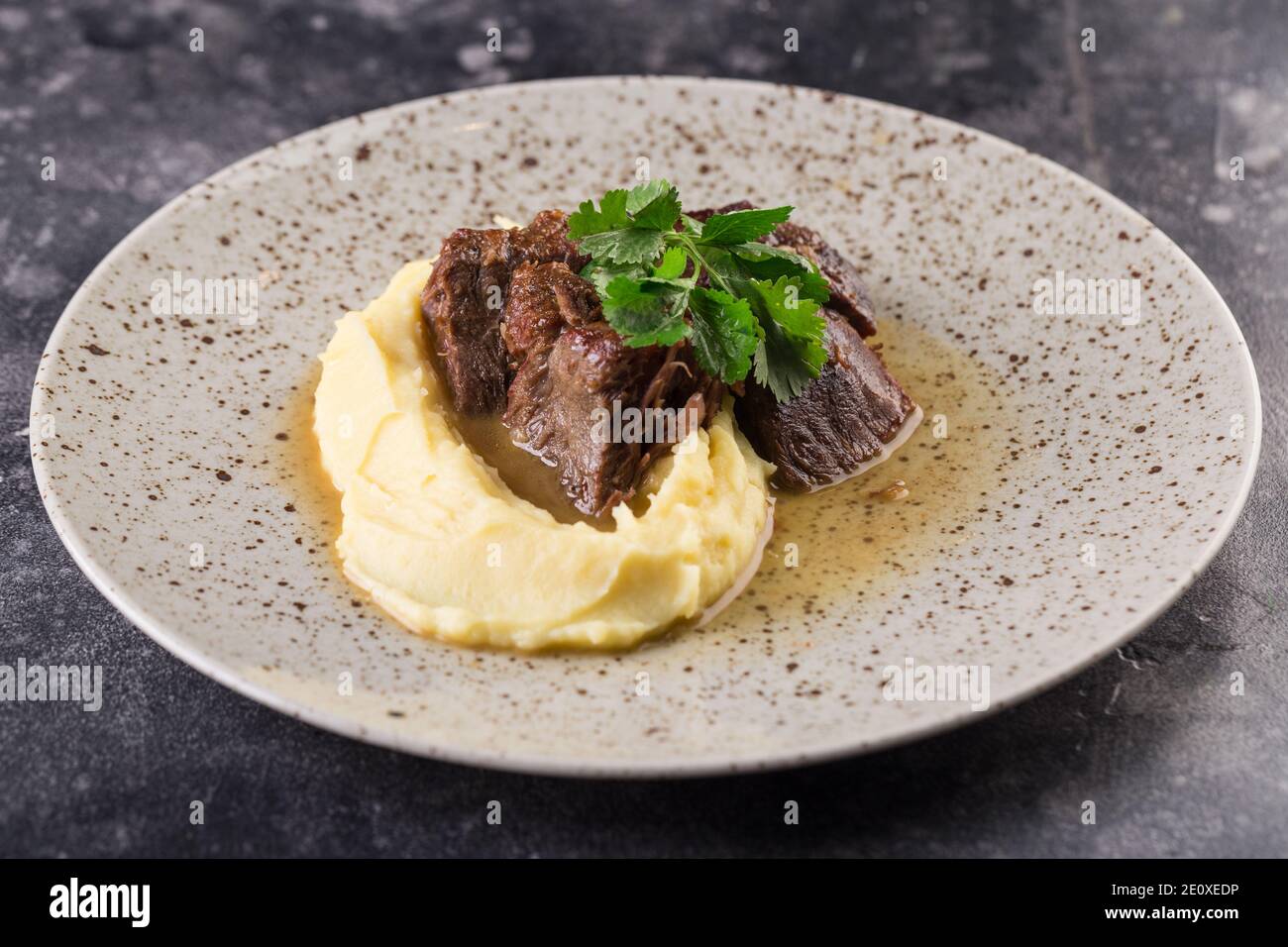 beef course with mashed potatoes and herbs. Photo for menu Stock Photo ...