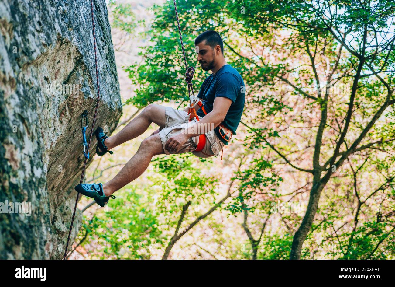The climber makes an ascent to the top of the mountain Stock Photo - Alamy