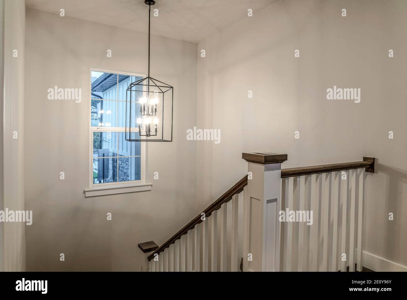 Ceiling light over staircase that connects the main floor to basement or  garage Stock Photo - Alamy