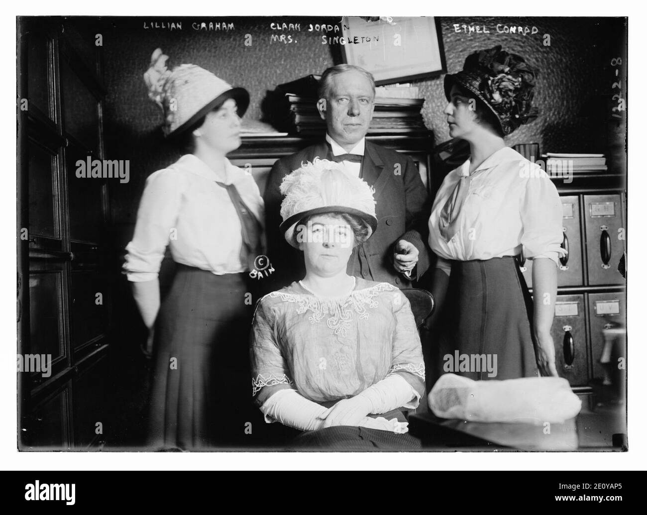 Lillian Graham (L), Clark Jordan (C), Ethel Conrad (R), and Mrs. Singleton (front seated) Stock Photo