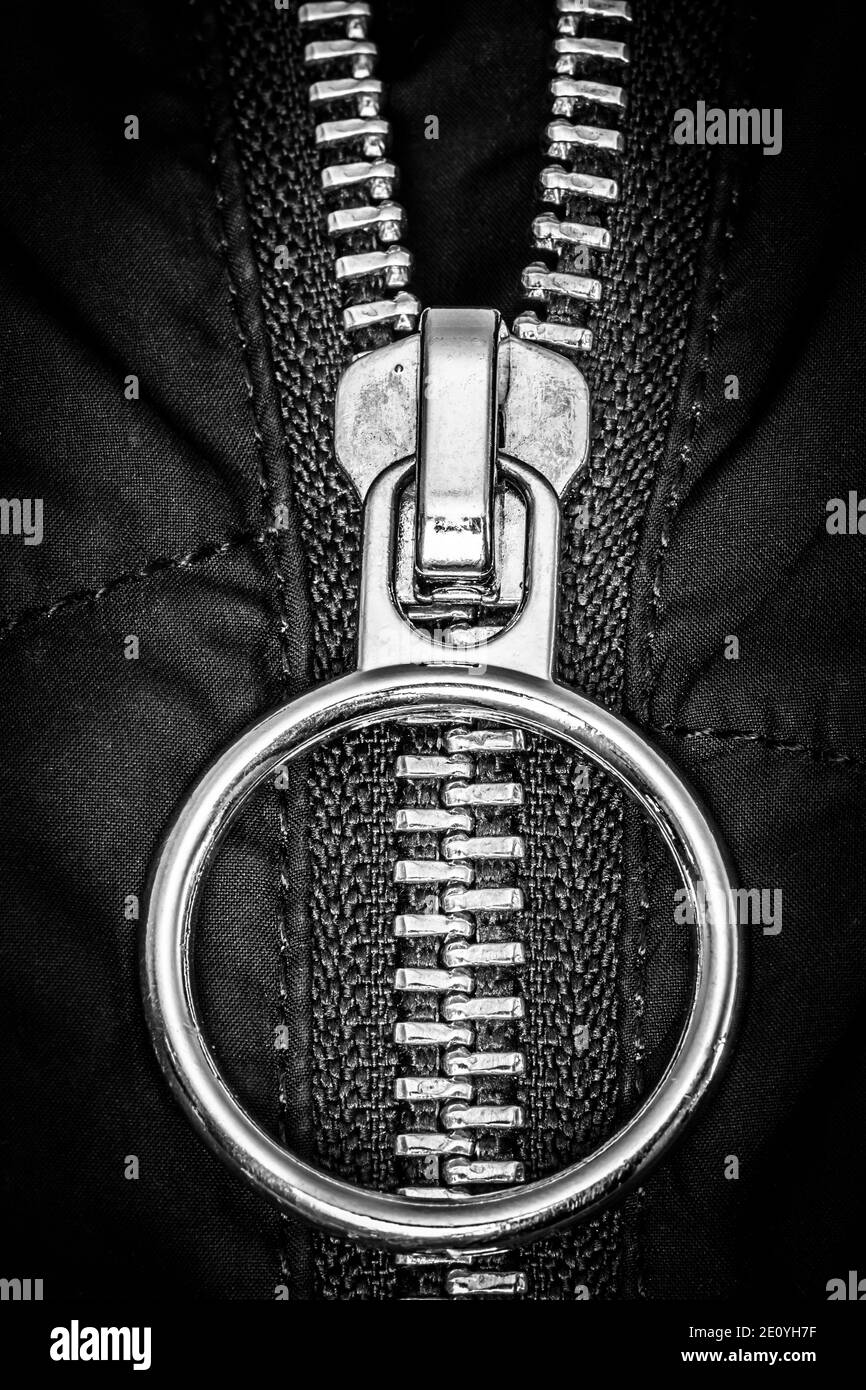 Chromed zipper lock on a black jacket close-up. Stock Photo
