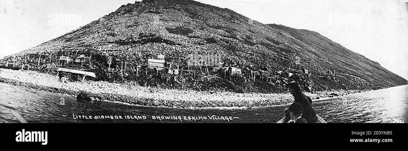Little Diomede Island, Alaska and an Eskimo village, as seen from a boat in the water, circa 1906 Stock Photo