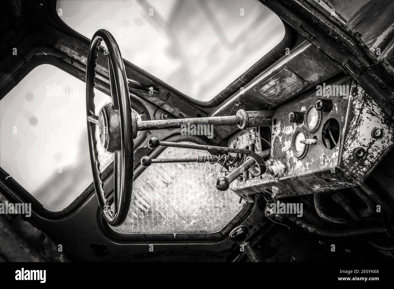 The instrument panel and steering wheel of the old rusty abandoned