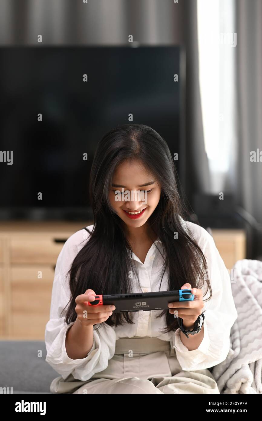 Chiang Mai Thailand. December 09, 2020. Young woman playing game on Nintendo  Switch console Stock Photo - Alamy