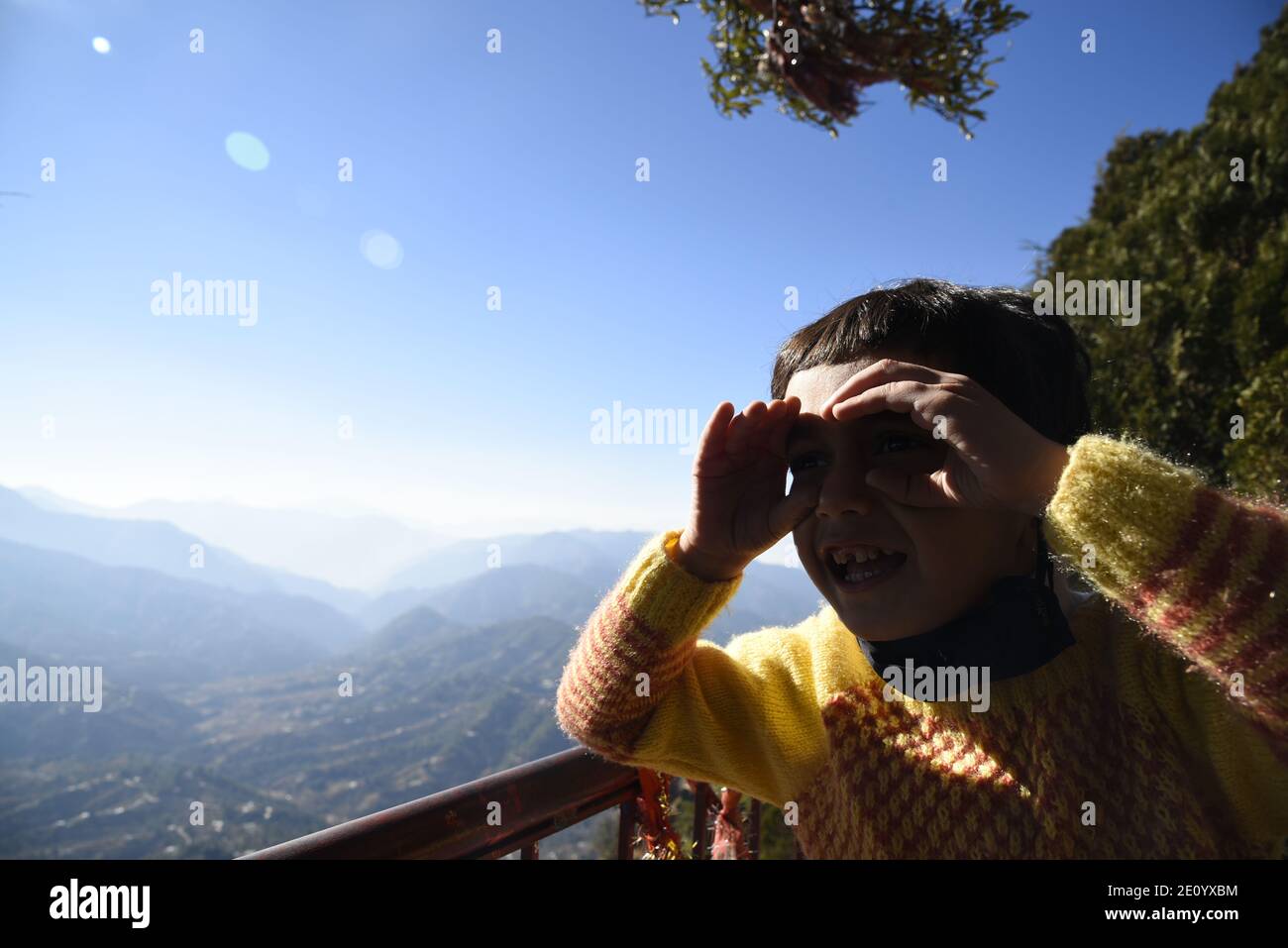 Scenic snow Himalayas mountain view from Hindu Lord Shiva Mukteshwar Temple located in Nainital District Uttarakhand state. Stock Photo