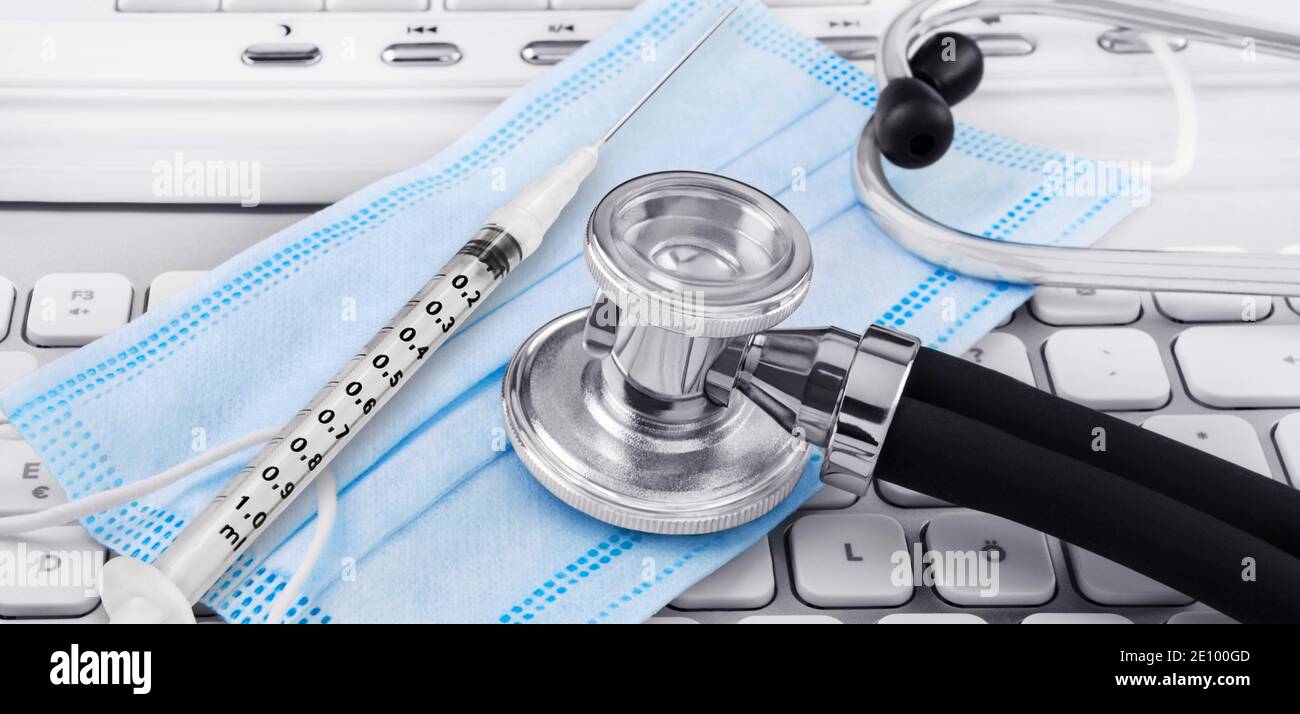 Injection with mask and stethoscope close up Stock Photo