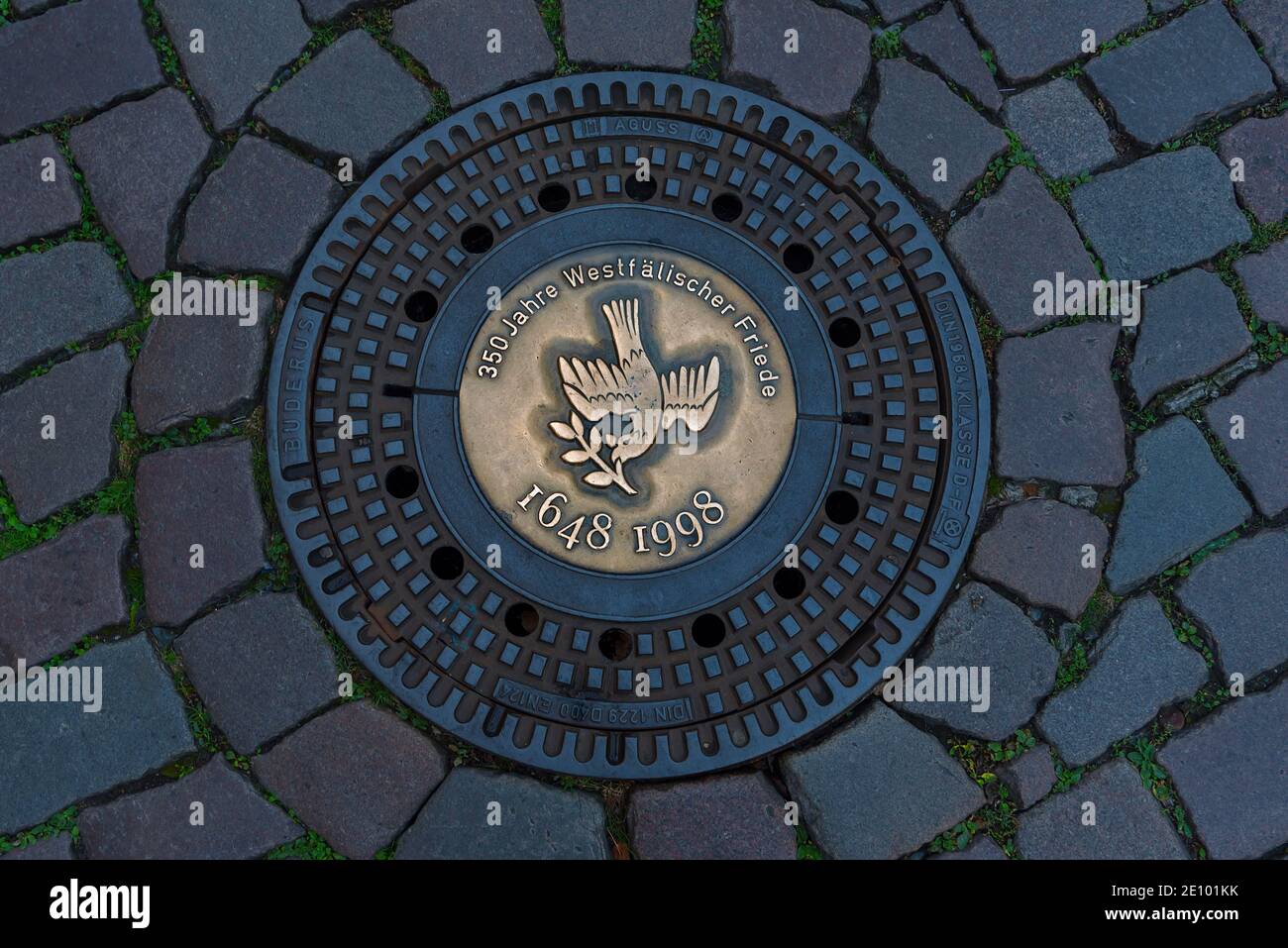 Manhole cover with peace dove, 350 Peace of Westphalia 1648 1998, Münster, North Rhine-Westphalia, Germany, Europe Stock Photo