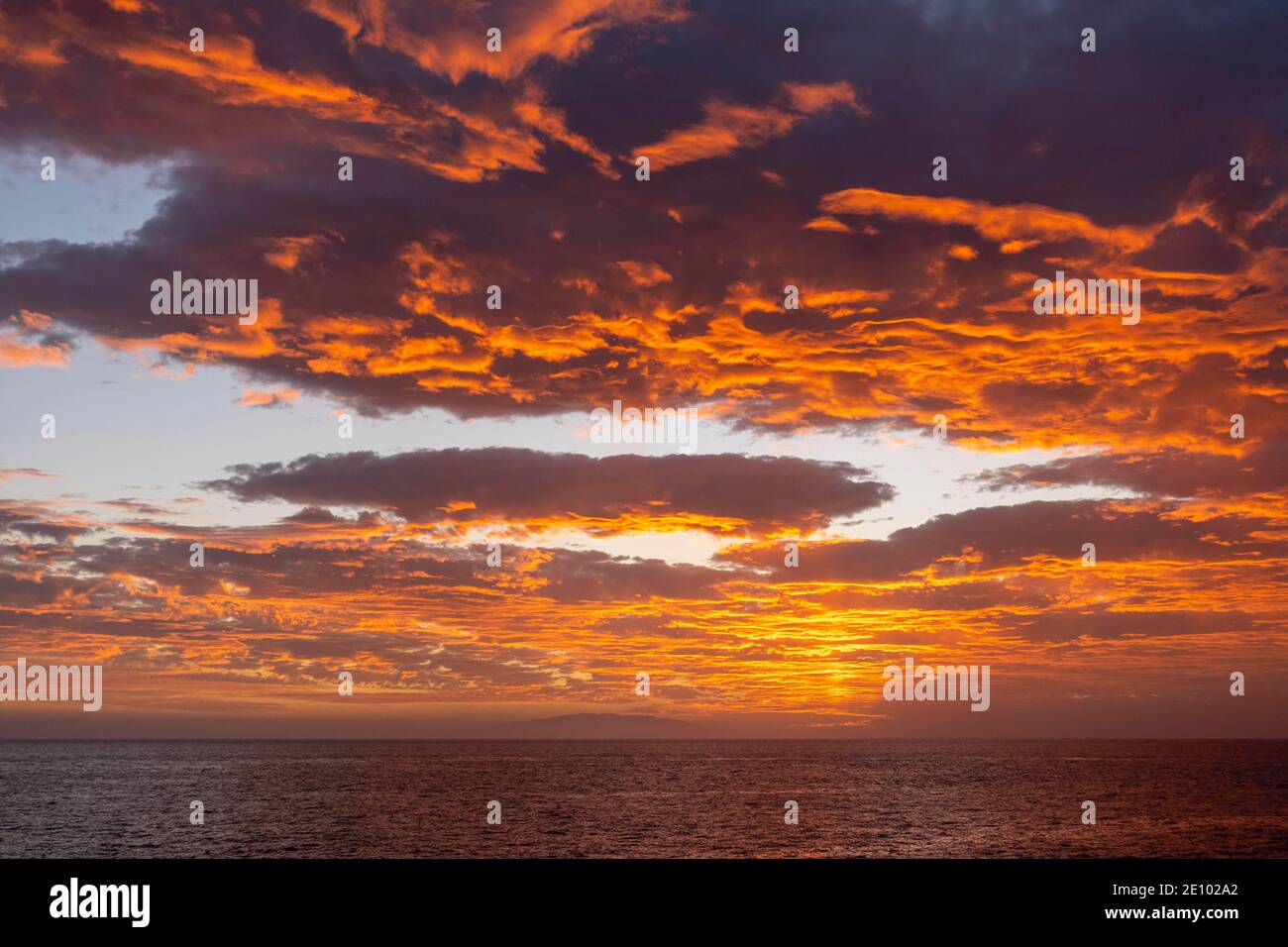 Dramatic cloudy sky, evening mood at the sea, in the back the island El Hierro, Valle Gran Rey, La Gomera, Canary Islands, Spain, Europe Stock Photo