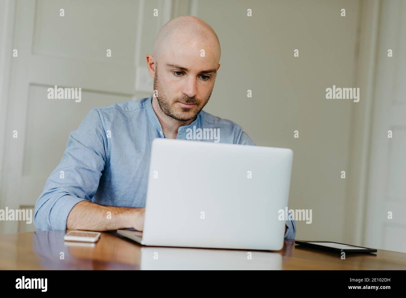 Man works on laptop, home office Stock Photo