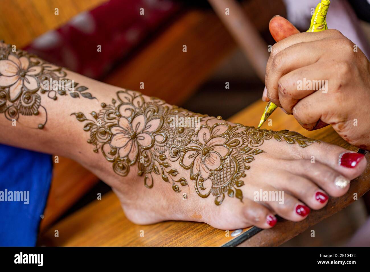 Henna tattoo on foot on a Hindu wedding eve in the island of Mauritius  Stock Photo - Alamy