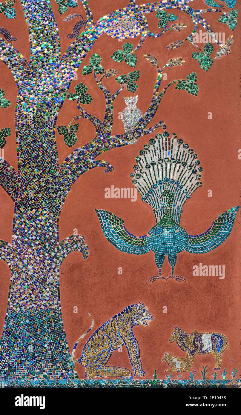 Glass mosaic shows the tree of life, as well as peacock, panther and other animals, Sim prayer hall, Wat Xieng Thong, Luang Prabang, Laos, Asia Stock Photo